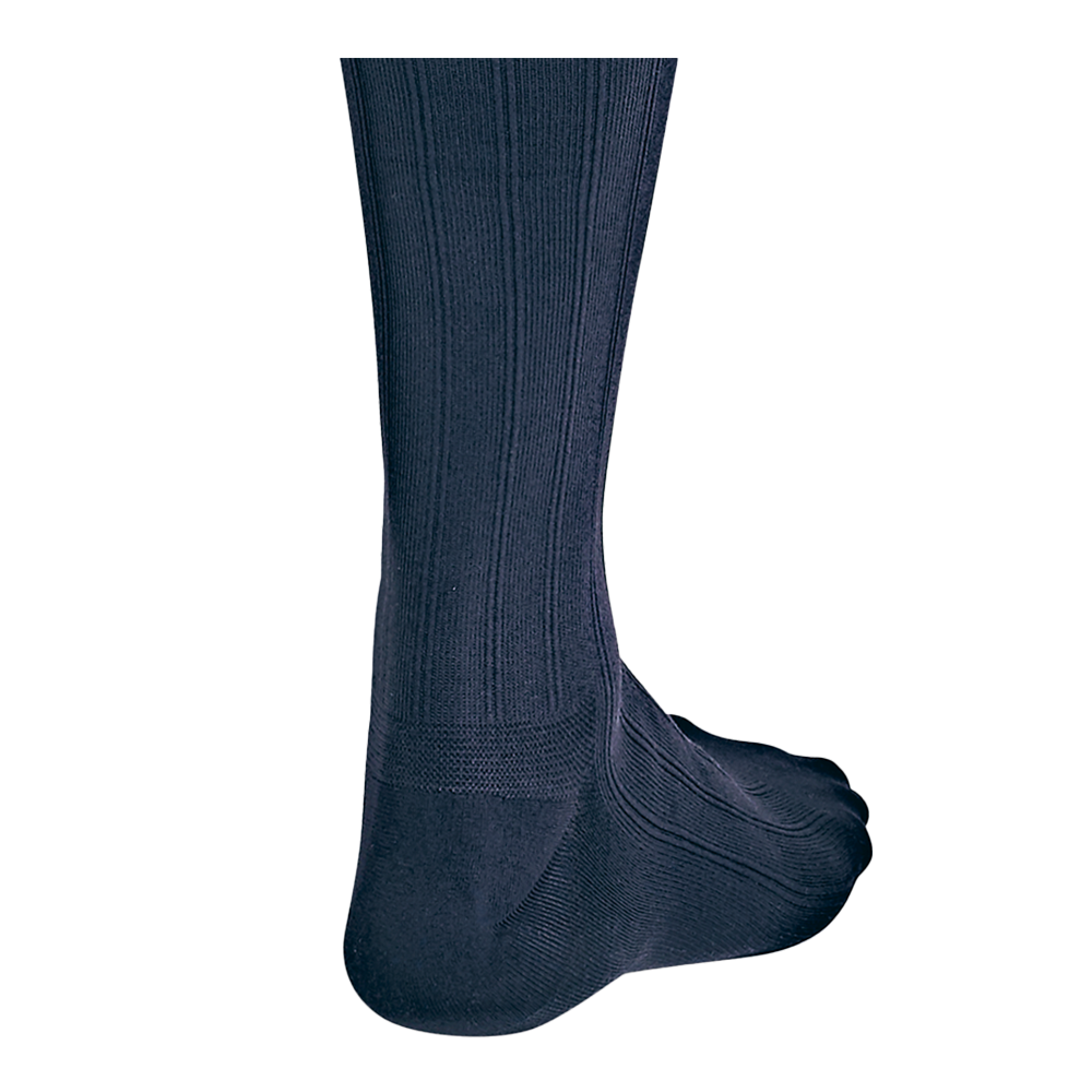 Close-up back view of a leg in JOBST For Men Explore navy compression socks.