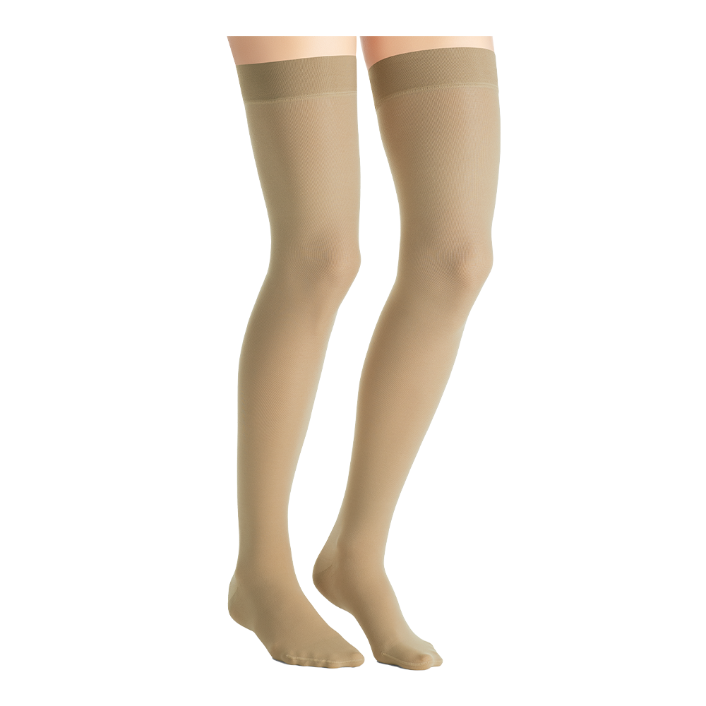 Close-up side view of a person wearing natural-colored JOBST UltraSheer thigh-high compression stockings.